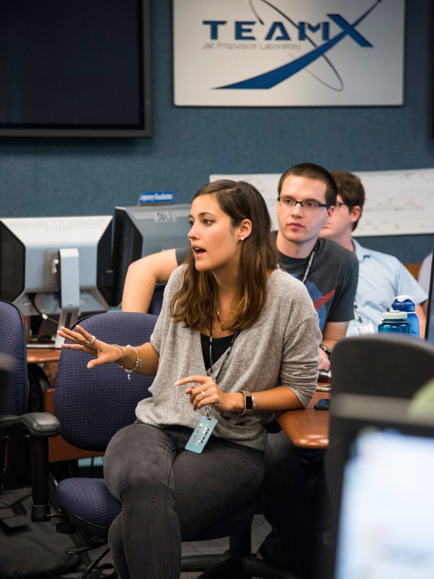 woman speaking to teh team at a Team-x meeting